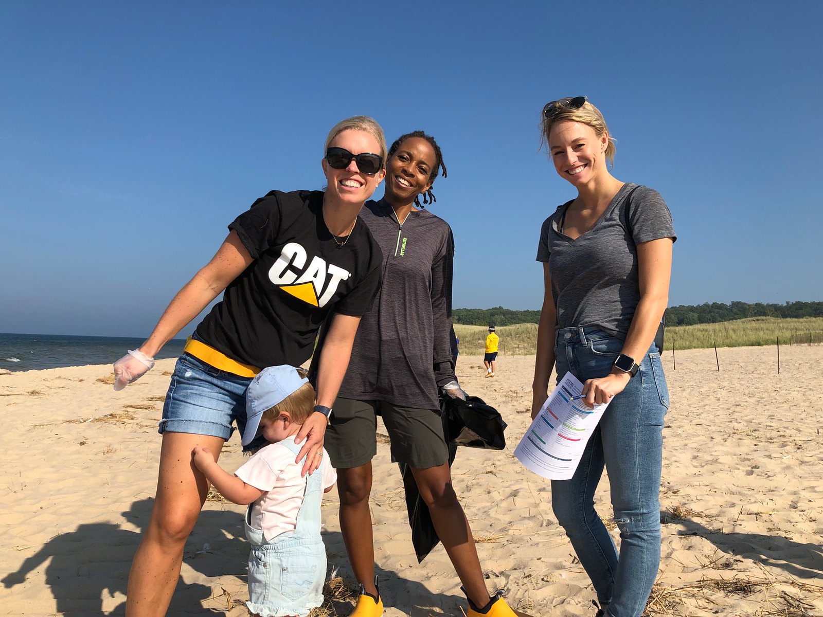 Four Cat Footwear volunteers on beach