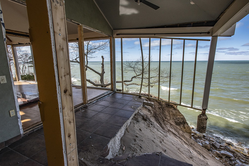 severe erosion with house falling into lake