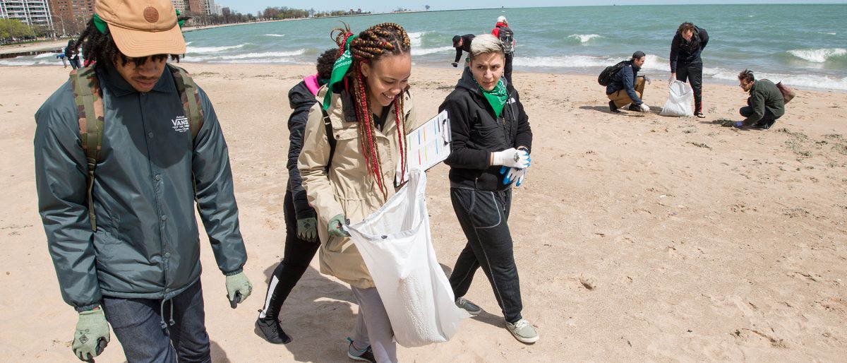 Adopt-a-Beach volunteers pick up litter from a beach in Chicago